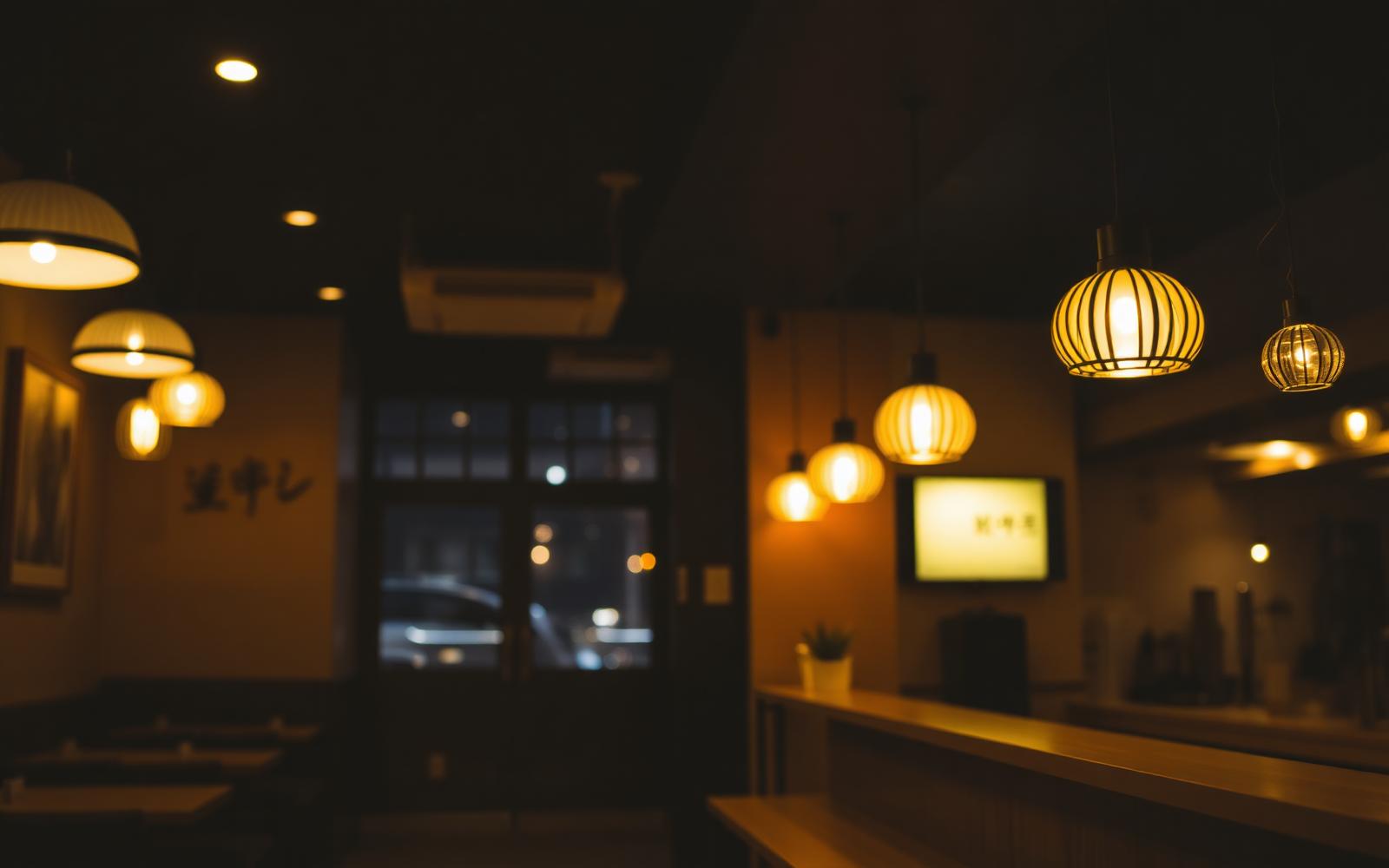 Warm restaurant interior with paper lanterns